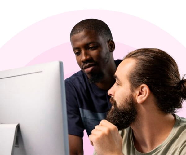 men looking at computer screen